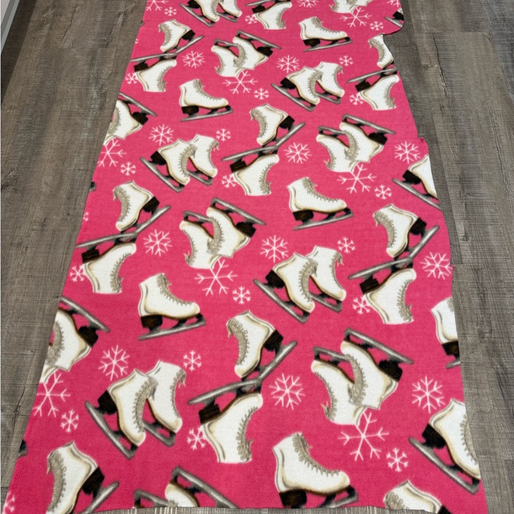 Fleece fabric ultra soft fleece pink with white ice skates on it